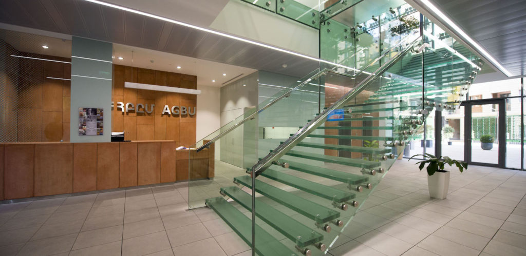 AGBU Armenia building's lobby which extends into a glass enclosed courtyard.