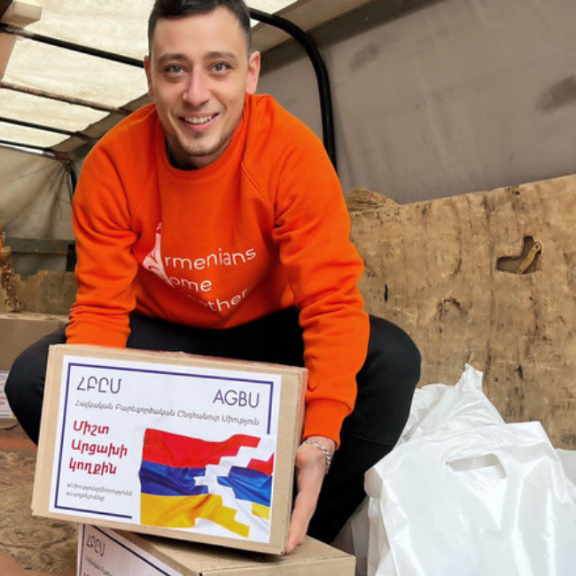 Volunteer distributing packages in Abovyan